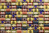 A vibrant display of soaps arranged in a wicker basket.