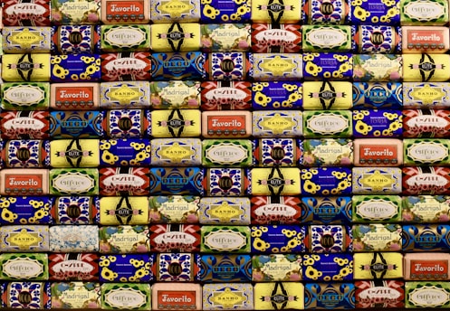 Elegant soap bars with vibrant packaging matching the detergent sachets.