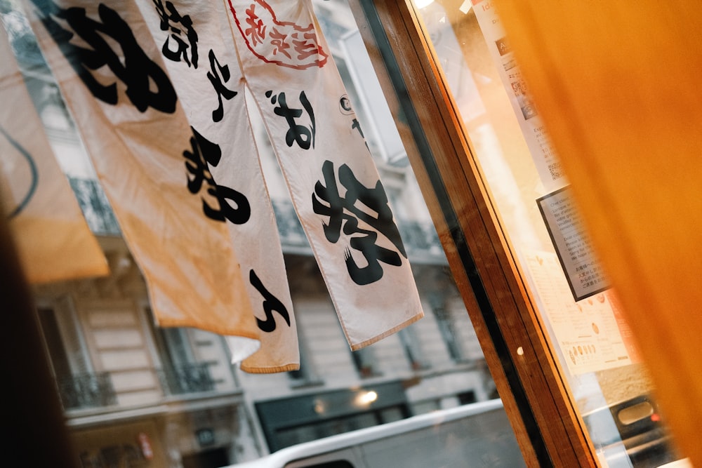 a couple of banners hanging from the side of a building