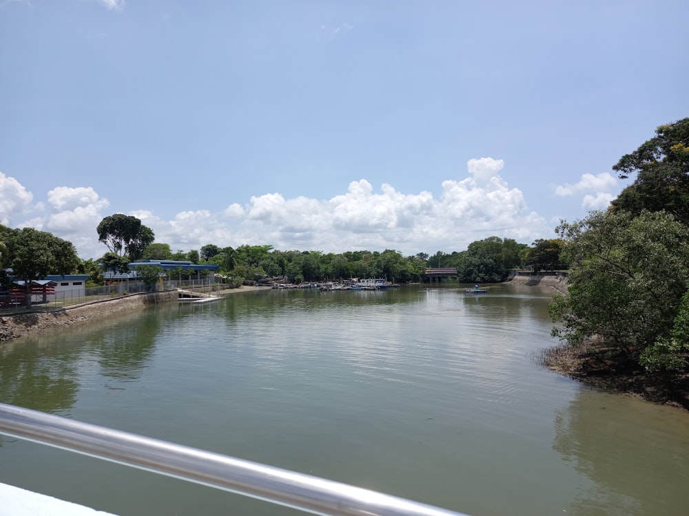 a body of water surrounded by trees and buildings