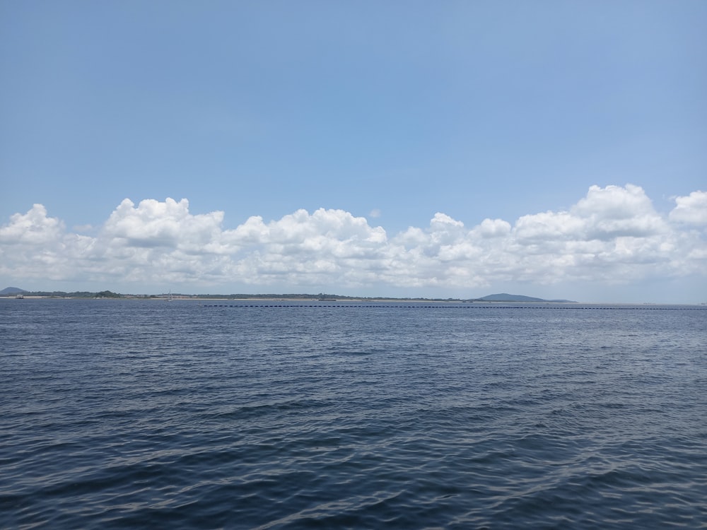 a body of water with a small island in the distance