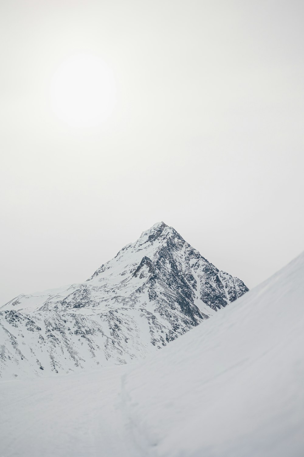 a person skiing down a snow covered mountain