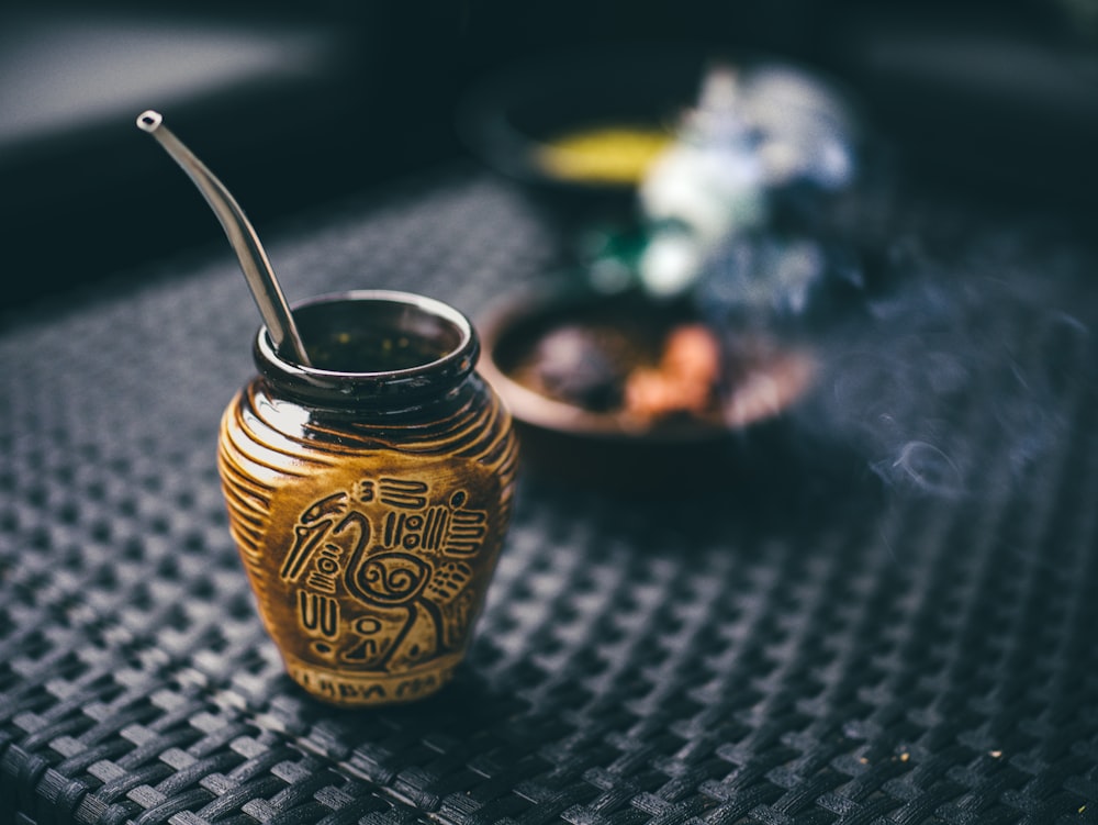 a glass jar with a pipe sticking out of it