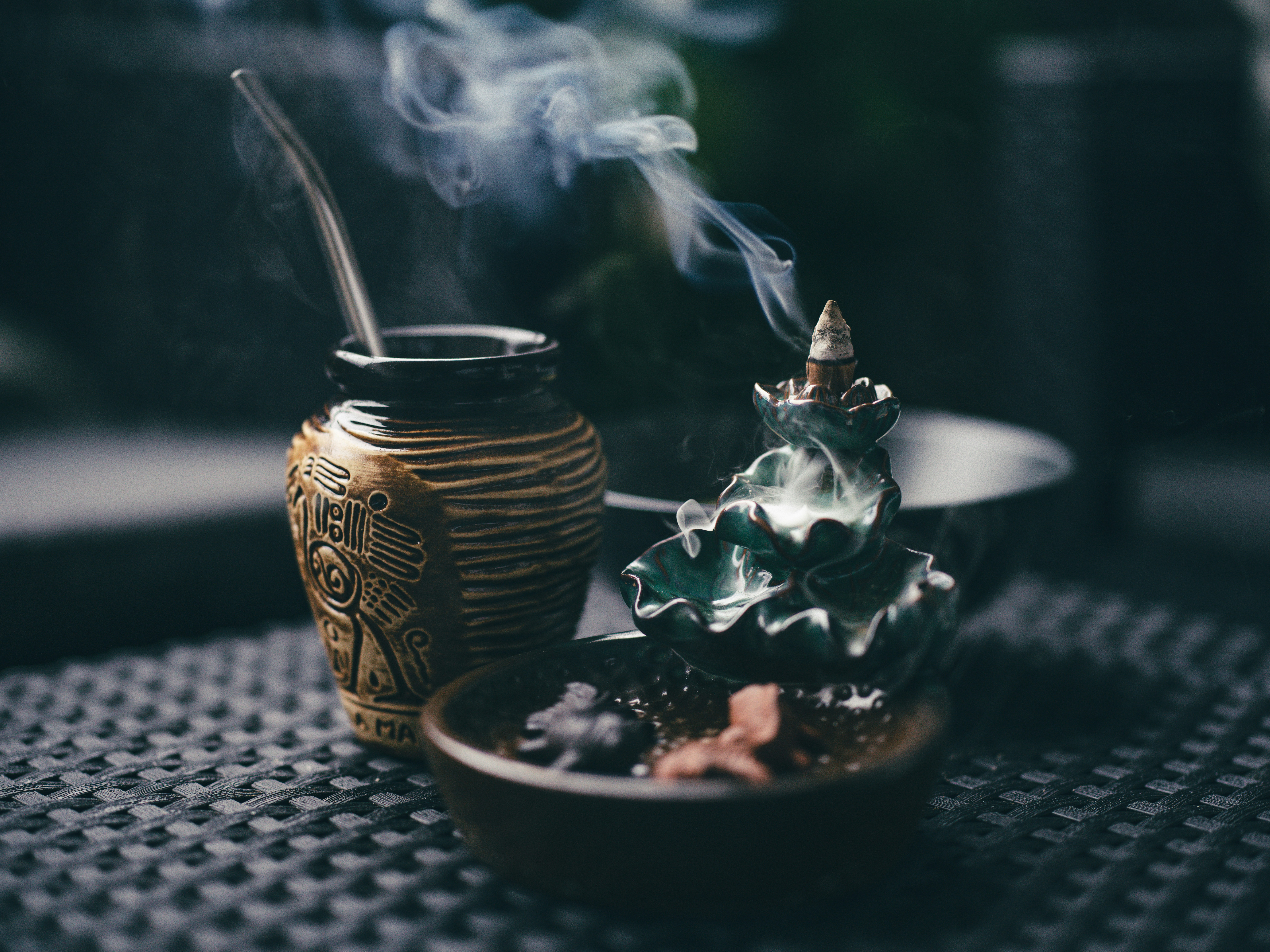 a cup with a straw and a cup with a straw in it on a table