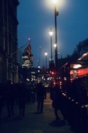 A bustling London street with electrical infrastructure being upgraded at dusk.