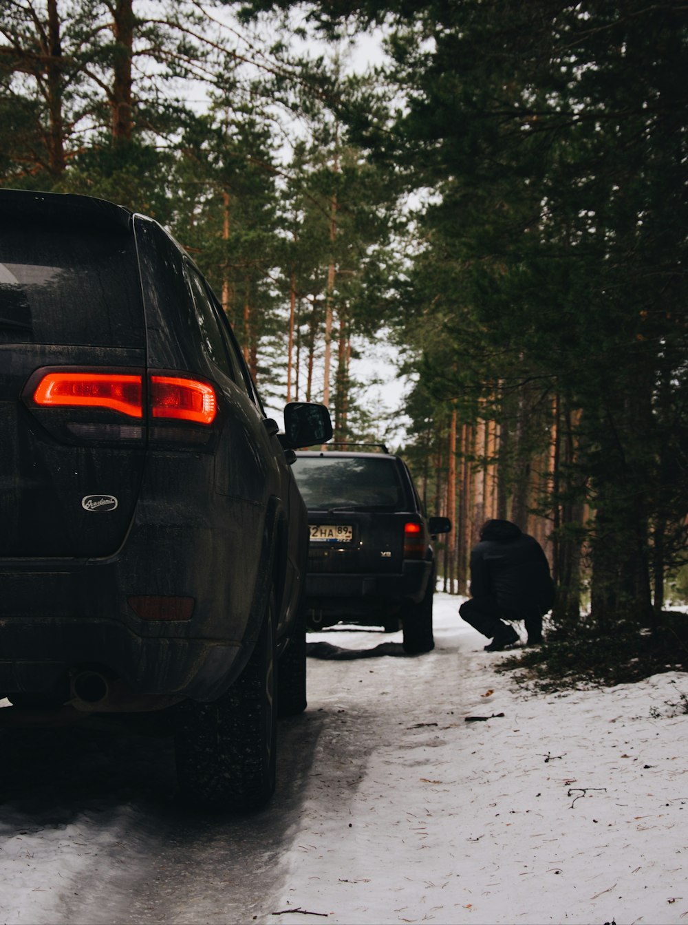 a couple of cars that are parked in the snow