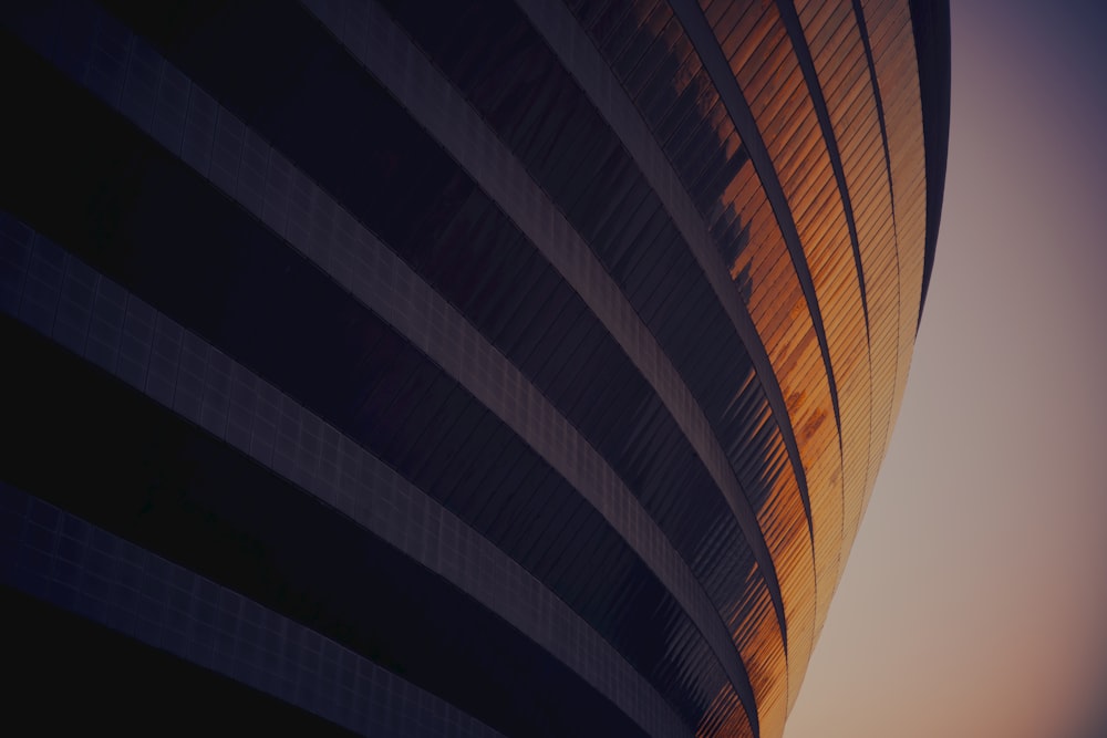 a tall building with a sky in the background