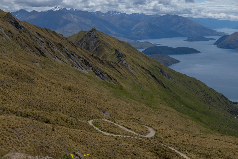 a view of a winding road in the mountains