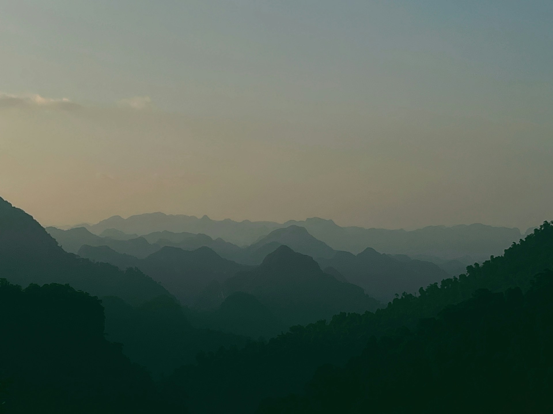 a view of a mountain range at sunset