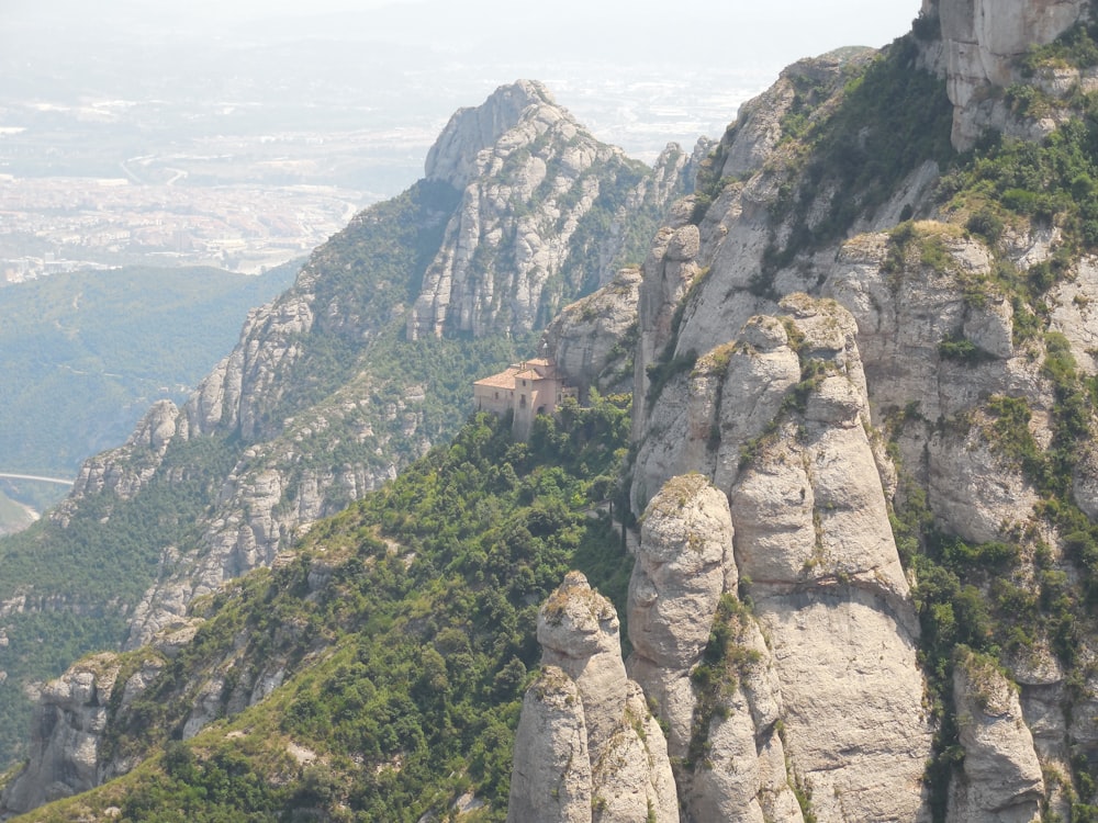 a view of a mountain with a house on top of it