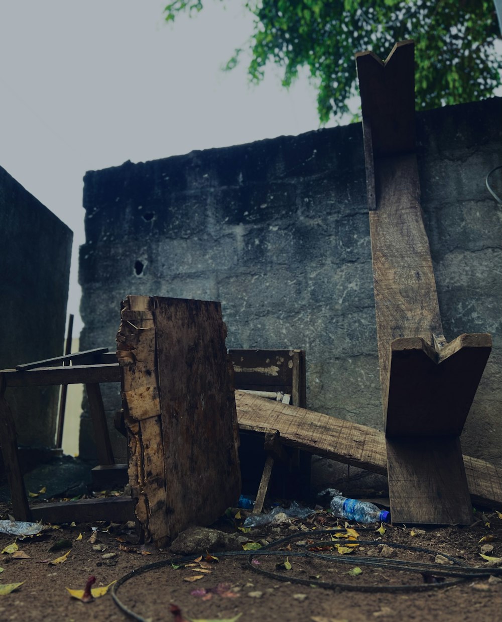 a pile of wood sitting next to a building