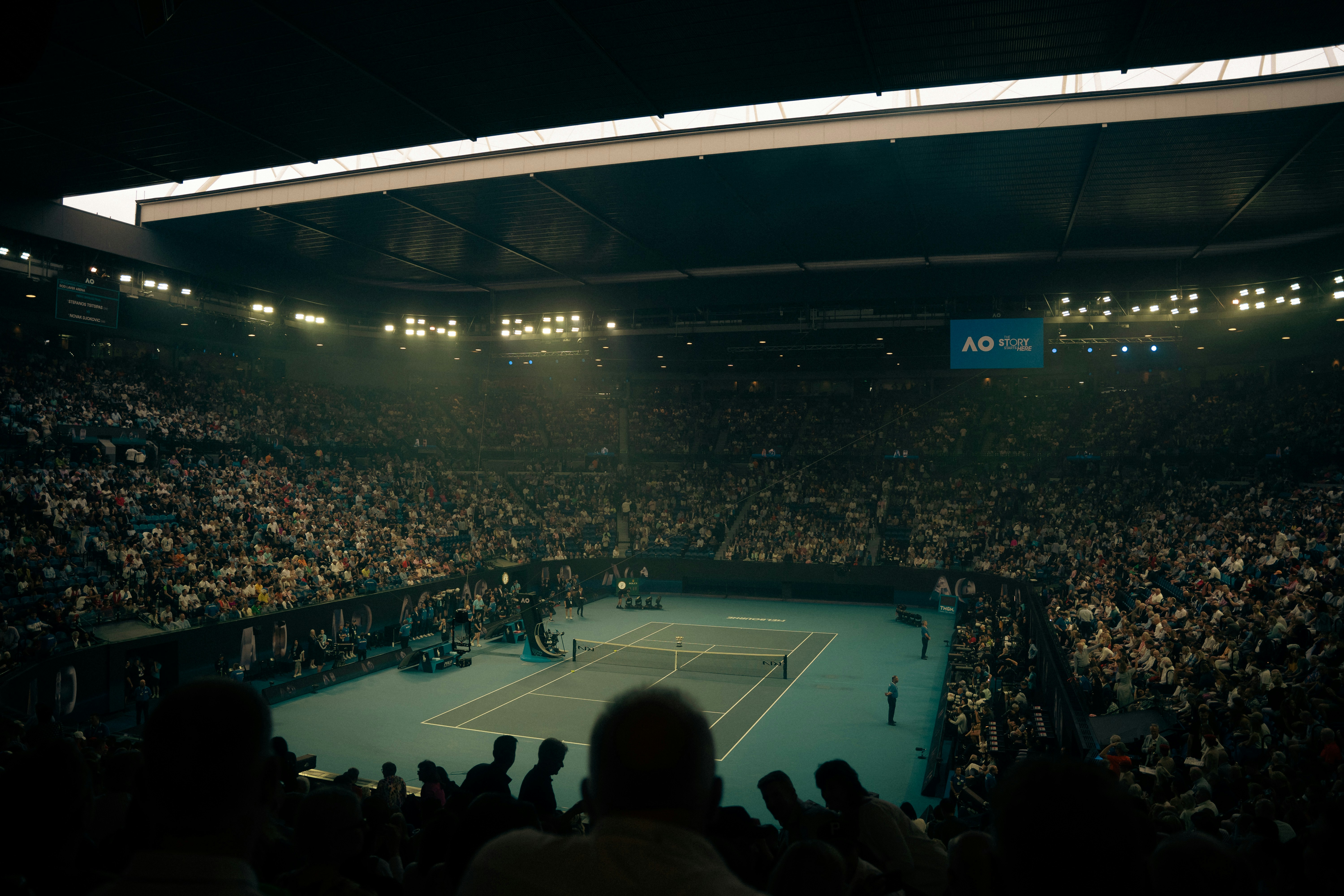 Tennis court with cheering crowd