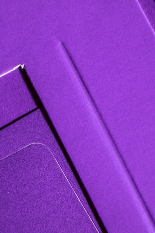 Abstract composition of overlapping fabric panels creating geometric shapes and shadows.