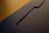 Close-up of a folder with custom branding and high-quality paper texture.