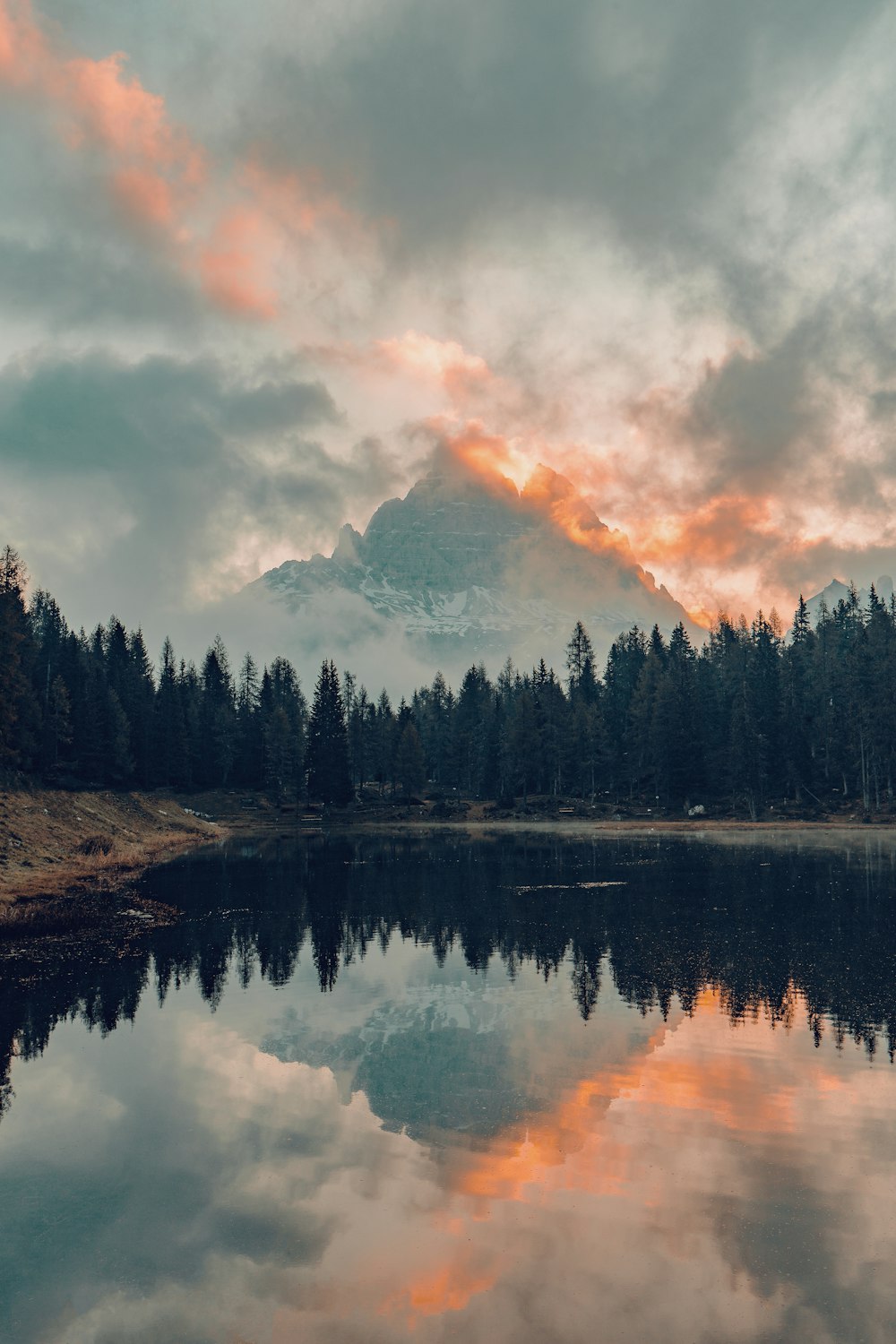 a lake with a mountain in the background