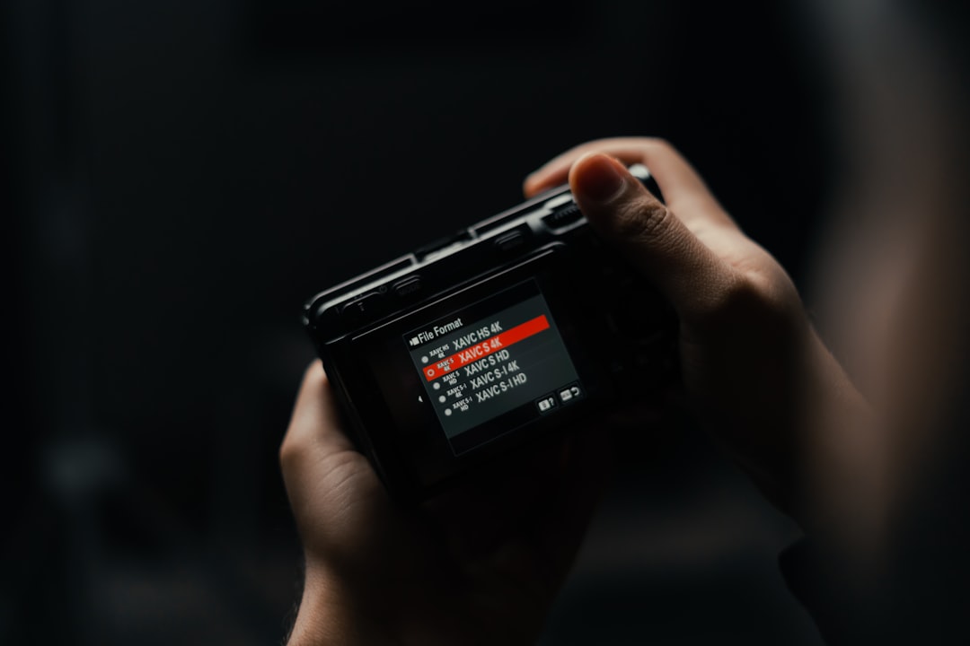 a person holding a camera in their hand, The beautiful Sony FX30.