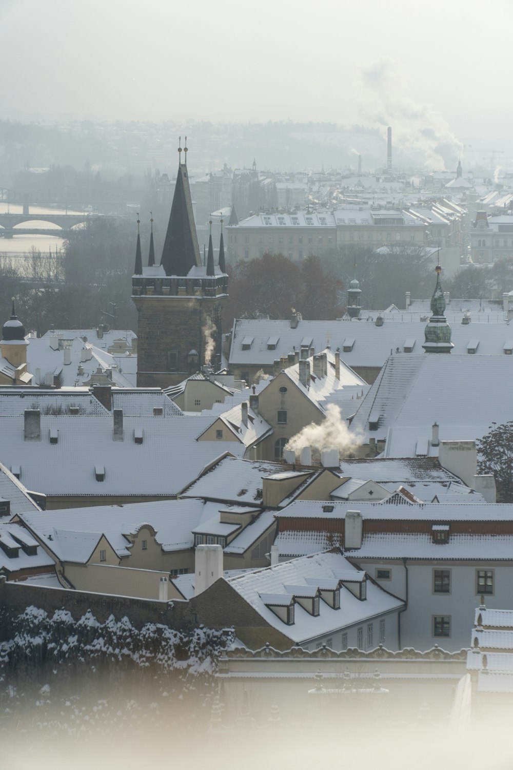a view of a snowy city from a window