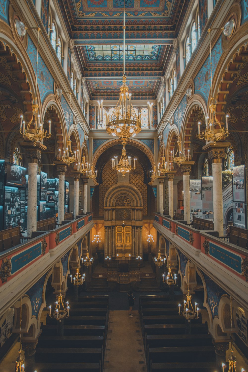 the interior of a large church with a chandelier