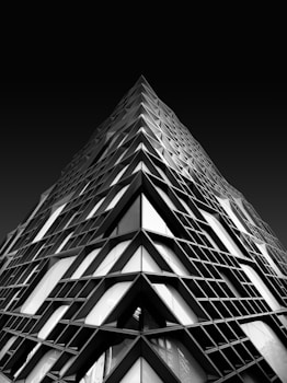 a black and white photo of a very tall building