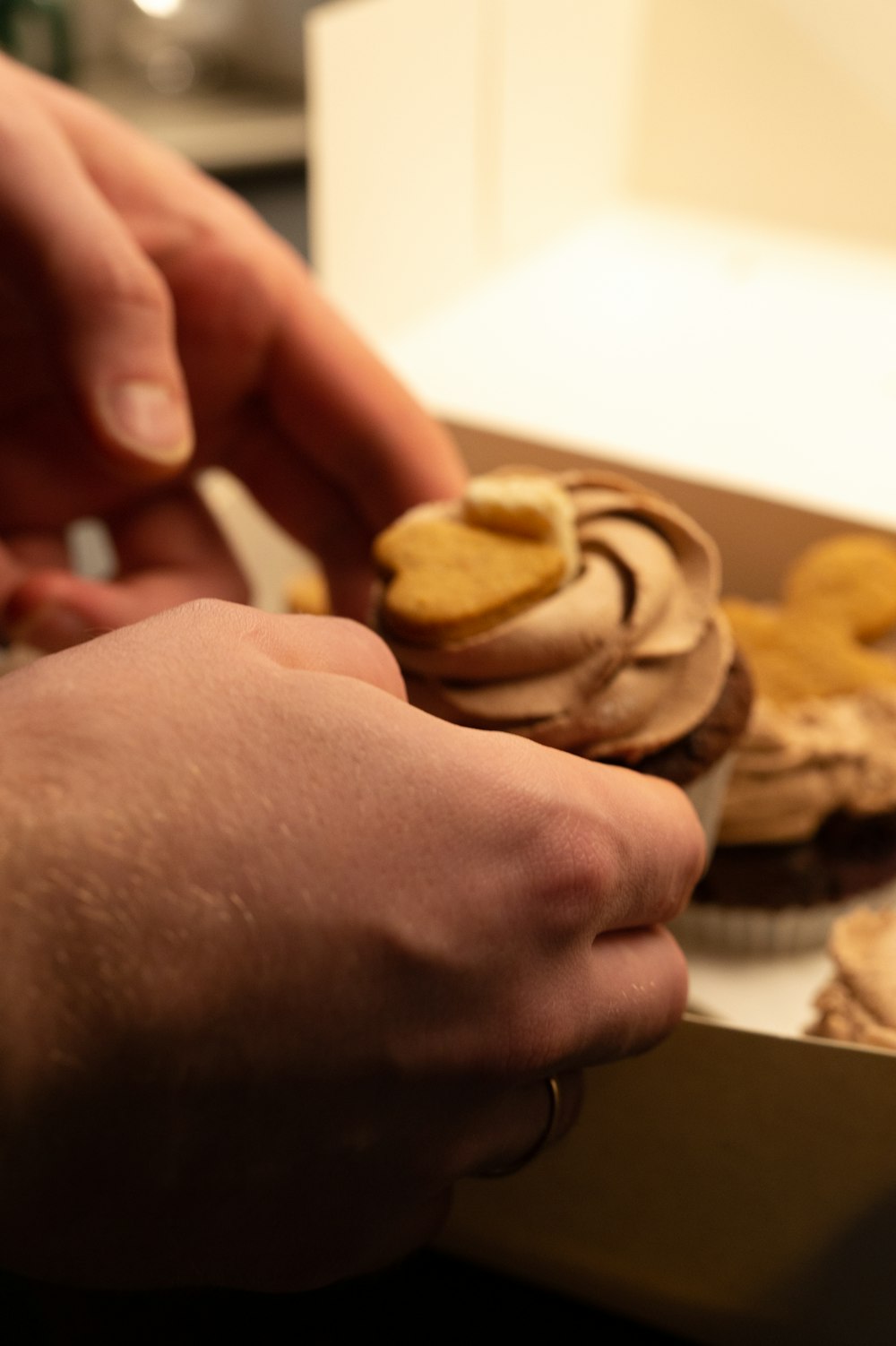 a person cutting a cookie with a knife