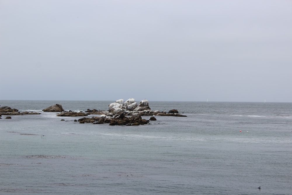 a large body of water surrounded by rocks