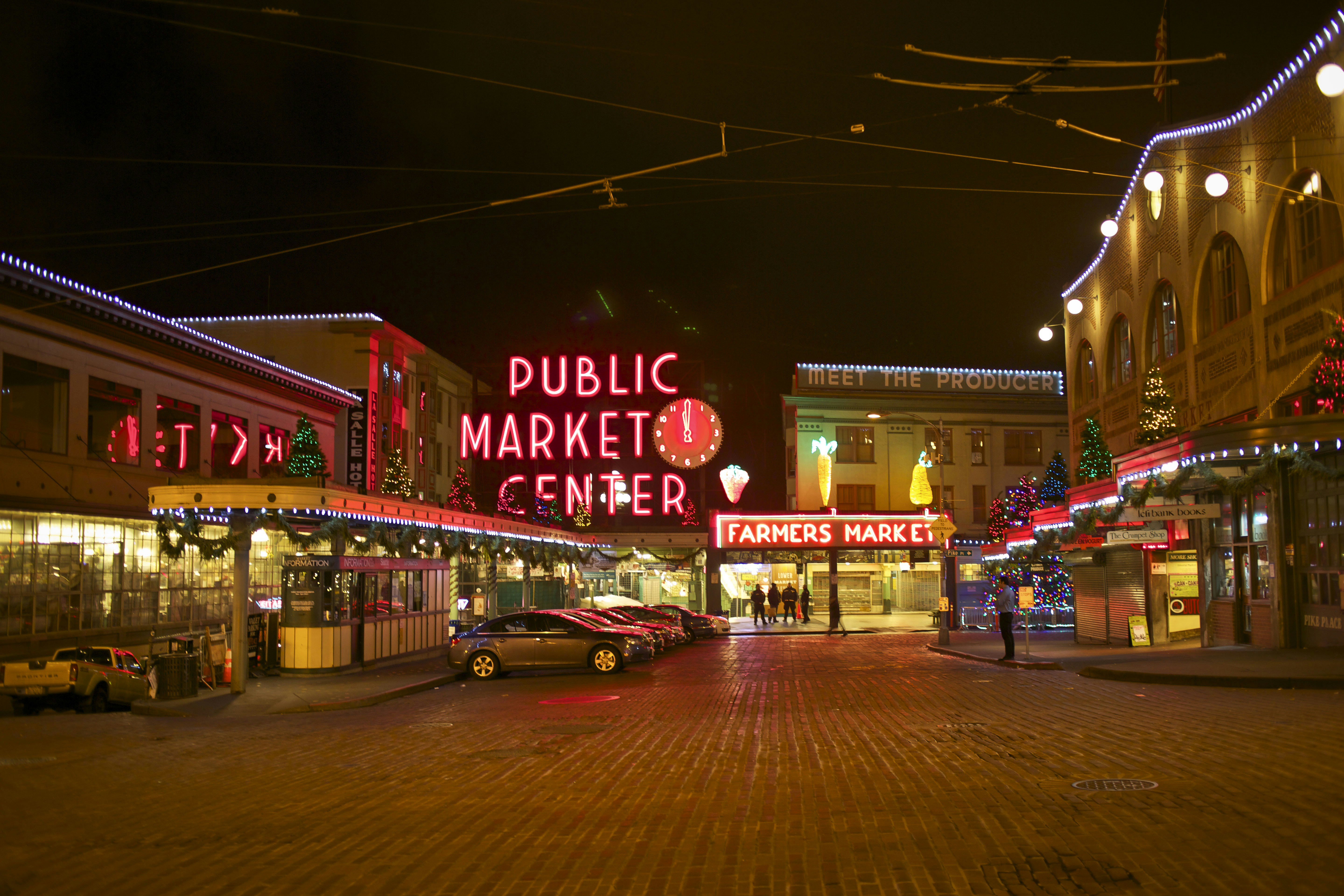 Vibrant digital illustration of an Indian market at night with neon signs and colourful stalls
