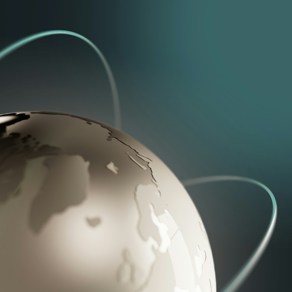 a close up of a white globe with a blue background
