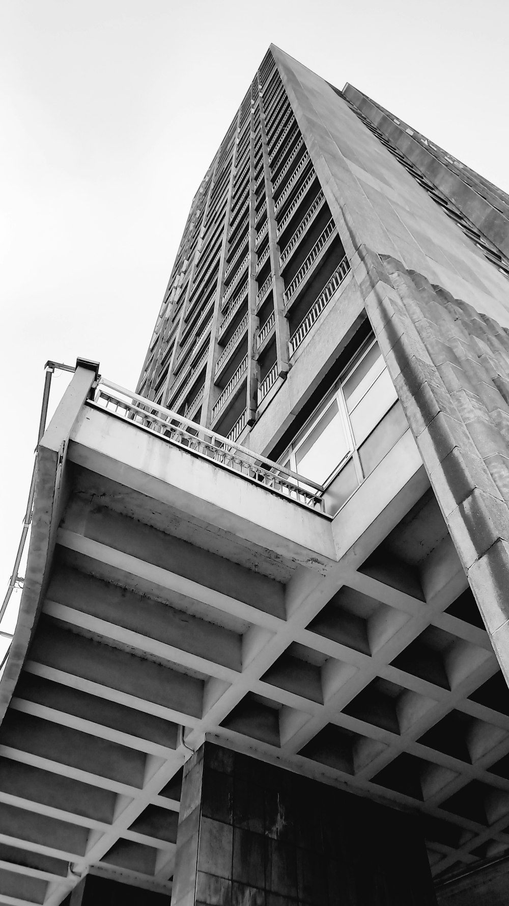 a black and white photo of a tall building