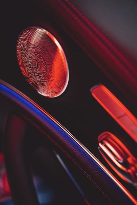 A sleek car interior featuring high-quality audio equipment and speakers.