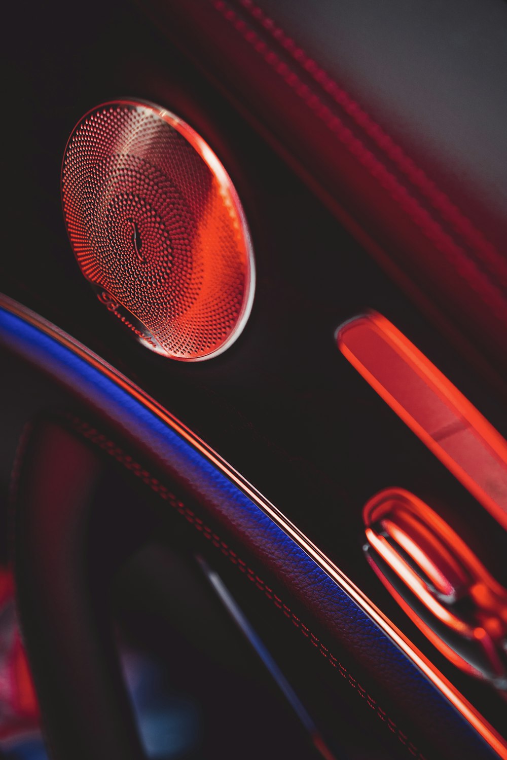 a close up of a car dashboard with a speaker