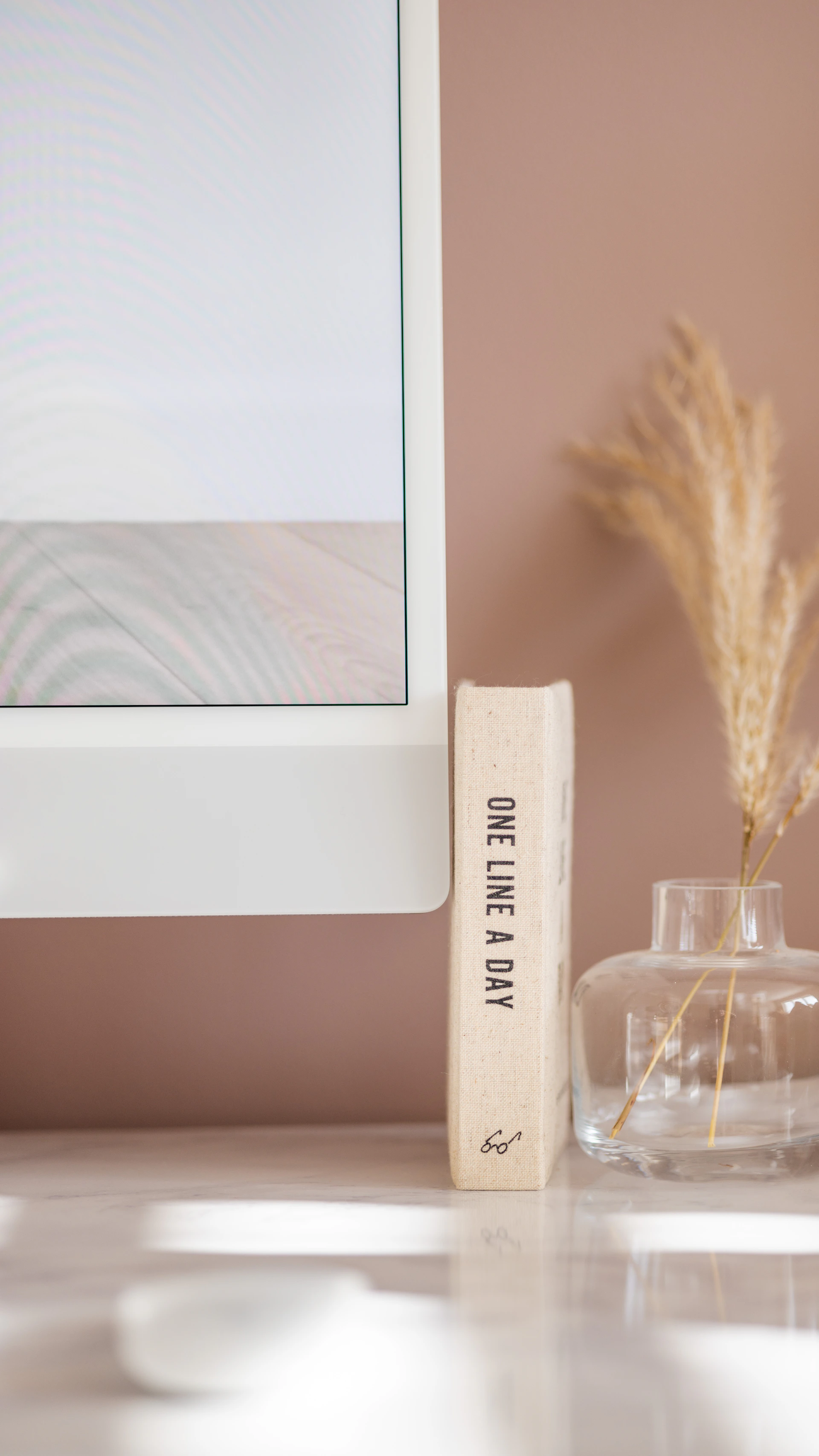 a computer monitor sitting on top of a desk