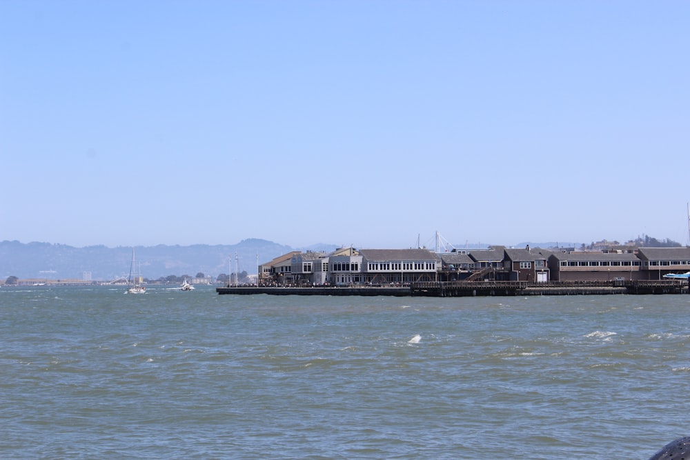 a large body of water next to a pier