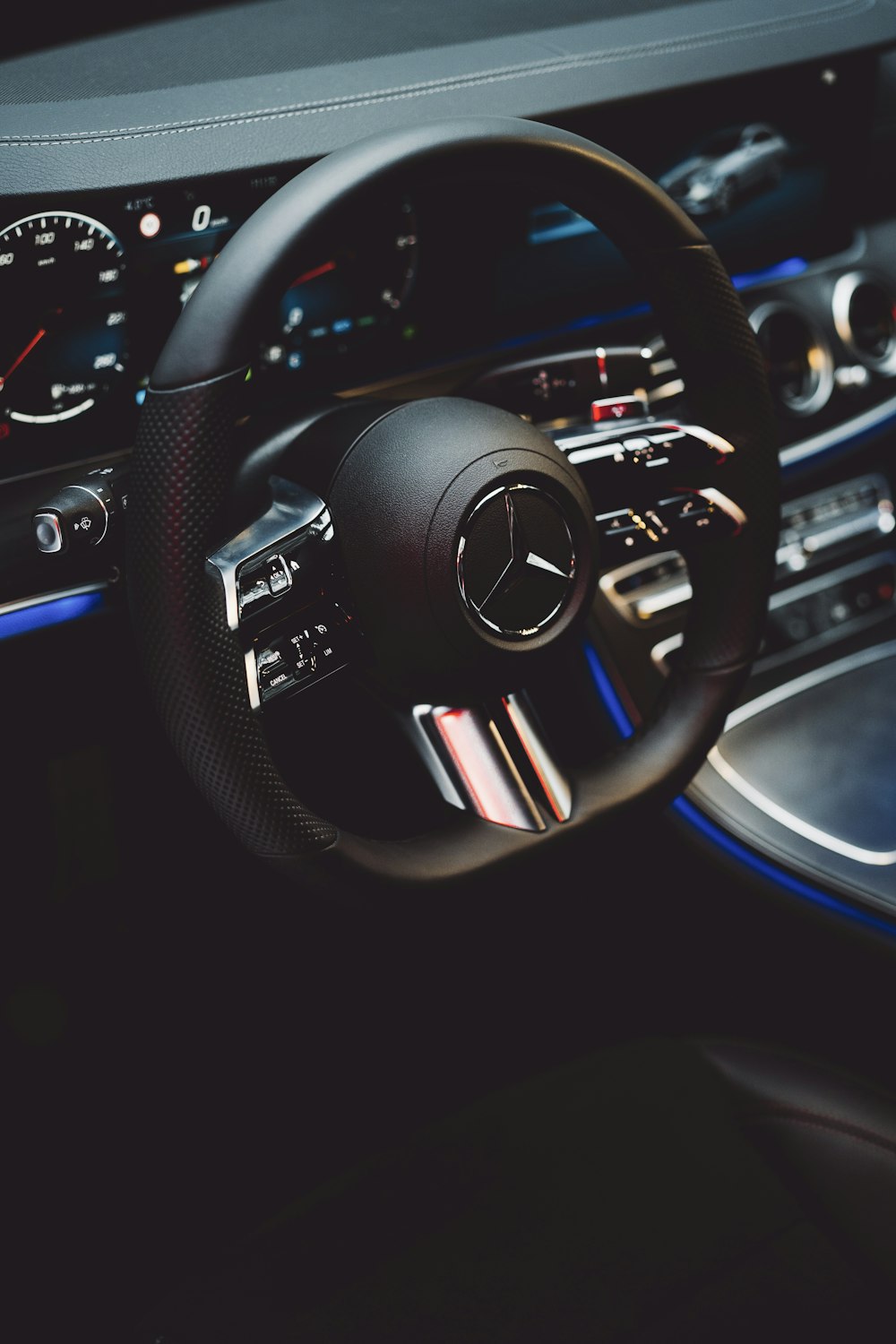 a steering wheel and dashboard of a car