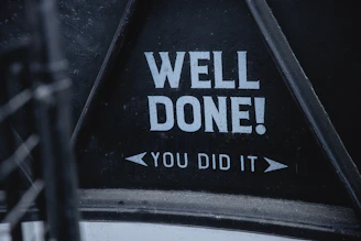 a sign that says well done you did it