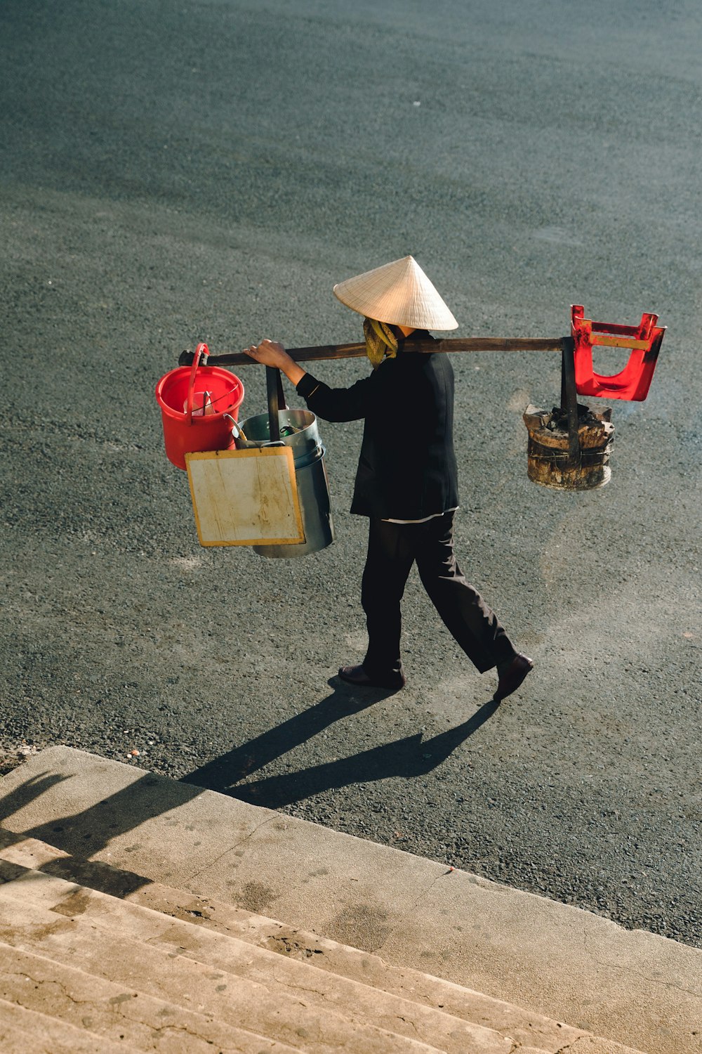 a person walking down a street carrying a bag