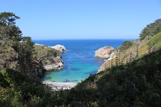 A beautiful coastline with clear sea greens inviting relaxation.