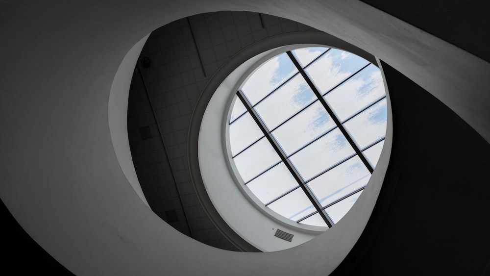 a circular window in a building with a skylight
