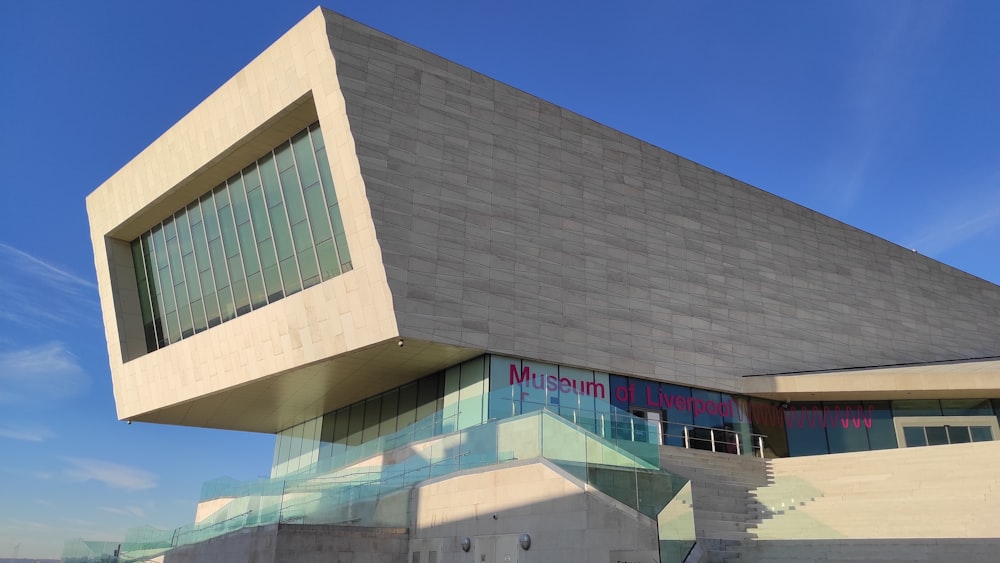 a large building with a triangular roof and windows