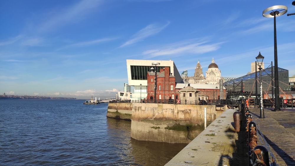 a view of a body of water with buildings in the background