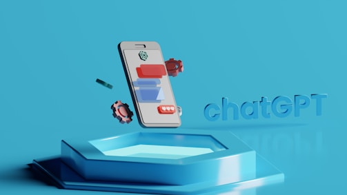 A digital illustration featuring a smartphone floating above a hexagonal platform, with gears and digital elements surrounding it. The screen displays a chatbot interface with various colored speech bubbles. The background is a solid light blue, emphasizing the technological theme. The text 'chatGPT' is displayed in 3D lettering on the right side.