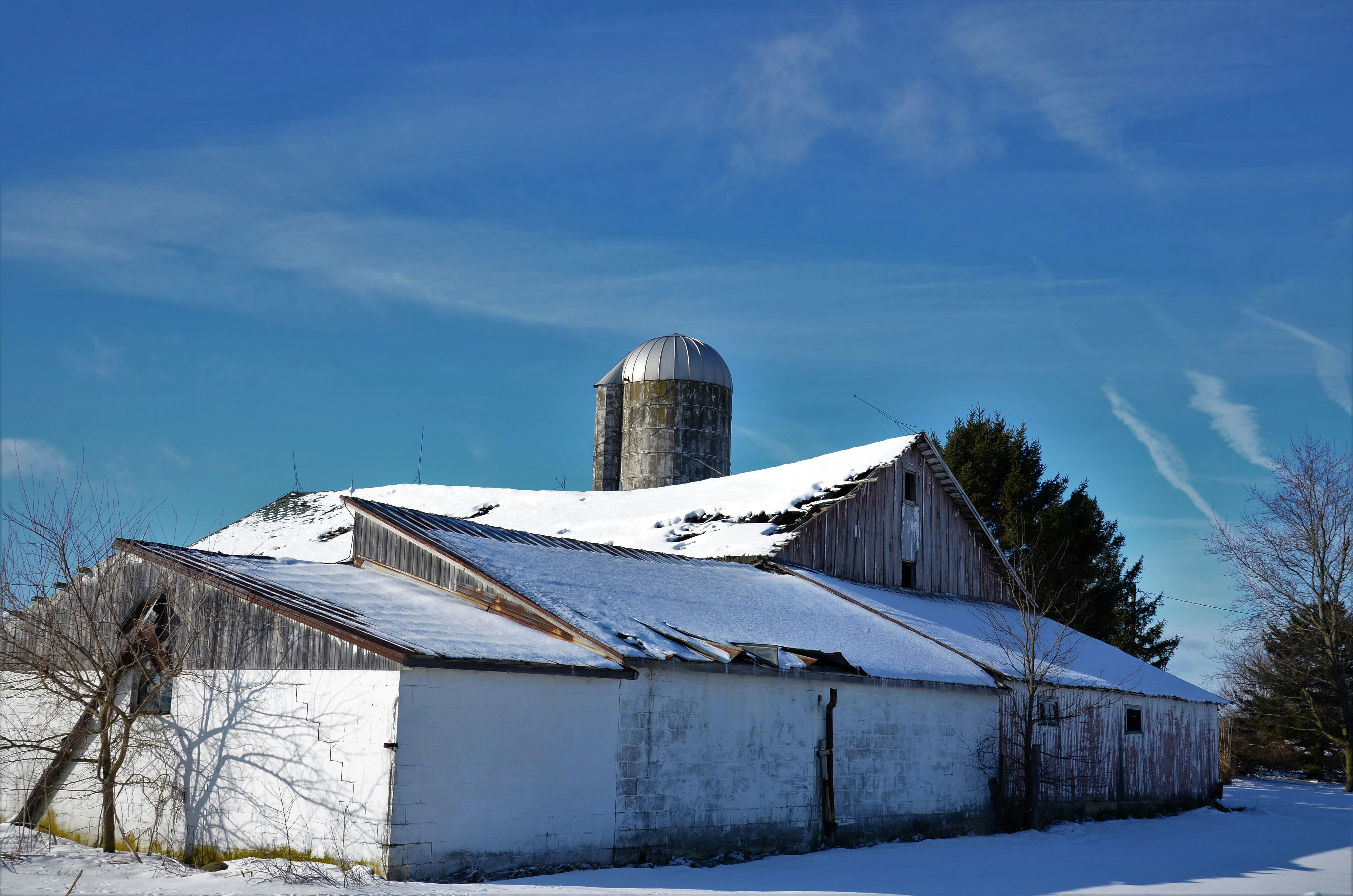 farm building with snow on the roof - insurance for farm buildings
