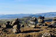 Dolomite rocks stacked in a mining yard under a clear sky