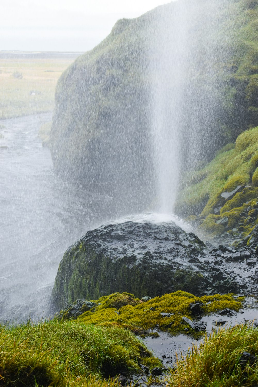 a large waterfall spewing water into the air