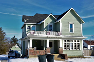a house with a truck parked in front of it