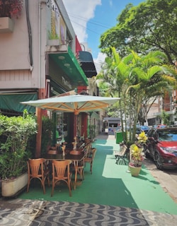 An inviting outdoor dining space nestled among tall trees and lush greenery.