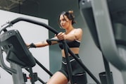 a woman on a treadmill in a gym