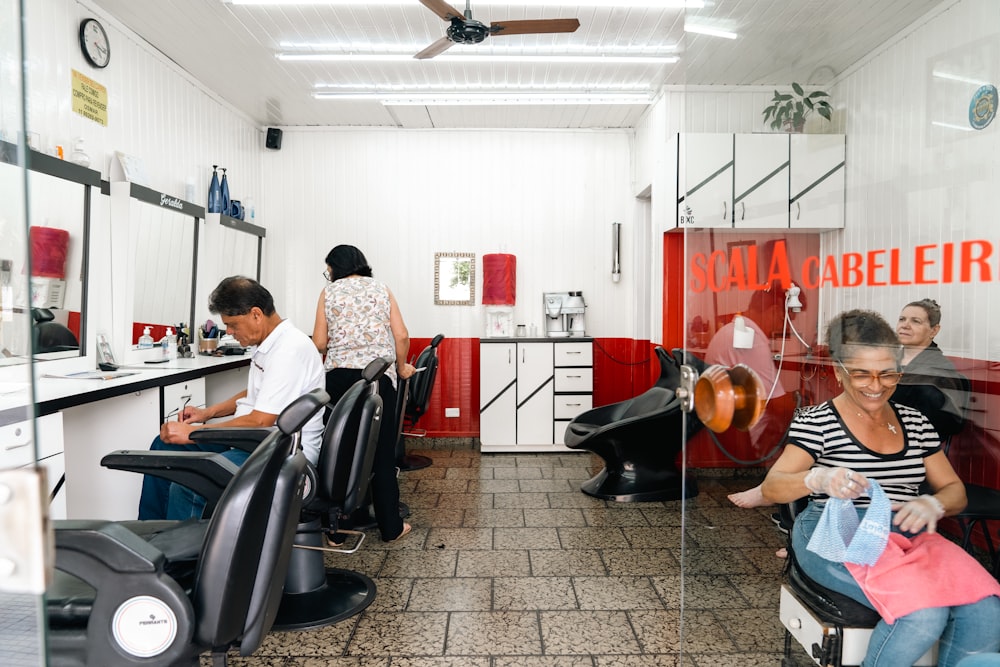 a woman sitting in a chair in a hair salon