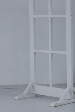 Sturdy fixed partition bracket holding a farmhouse-style wooden divider