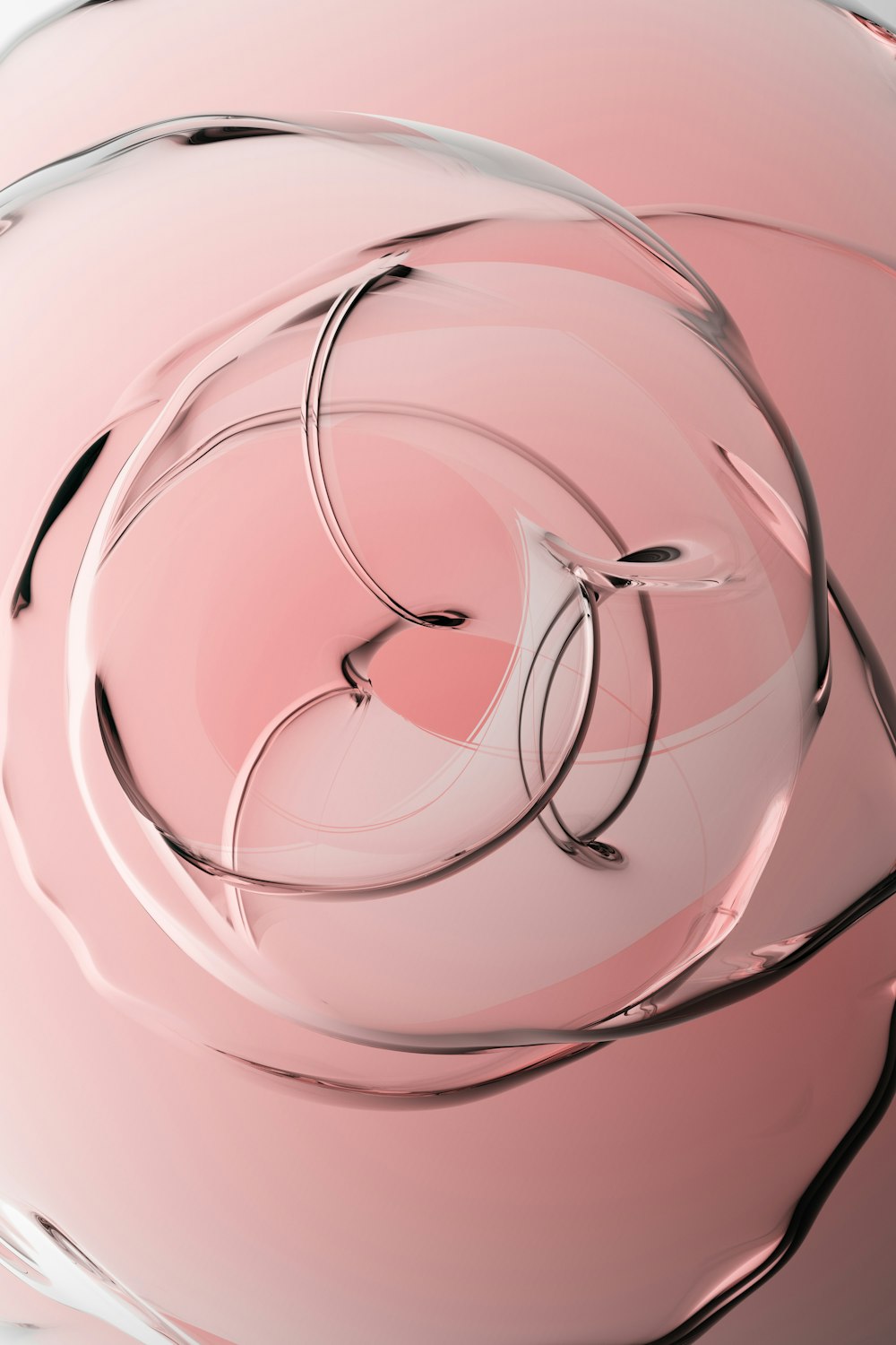 a close up of a circular object on a pink background