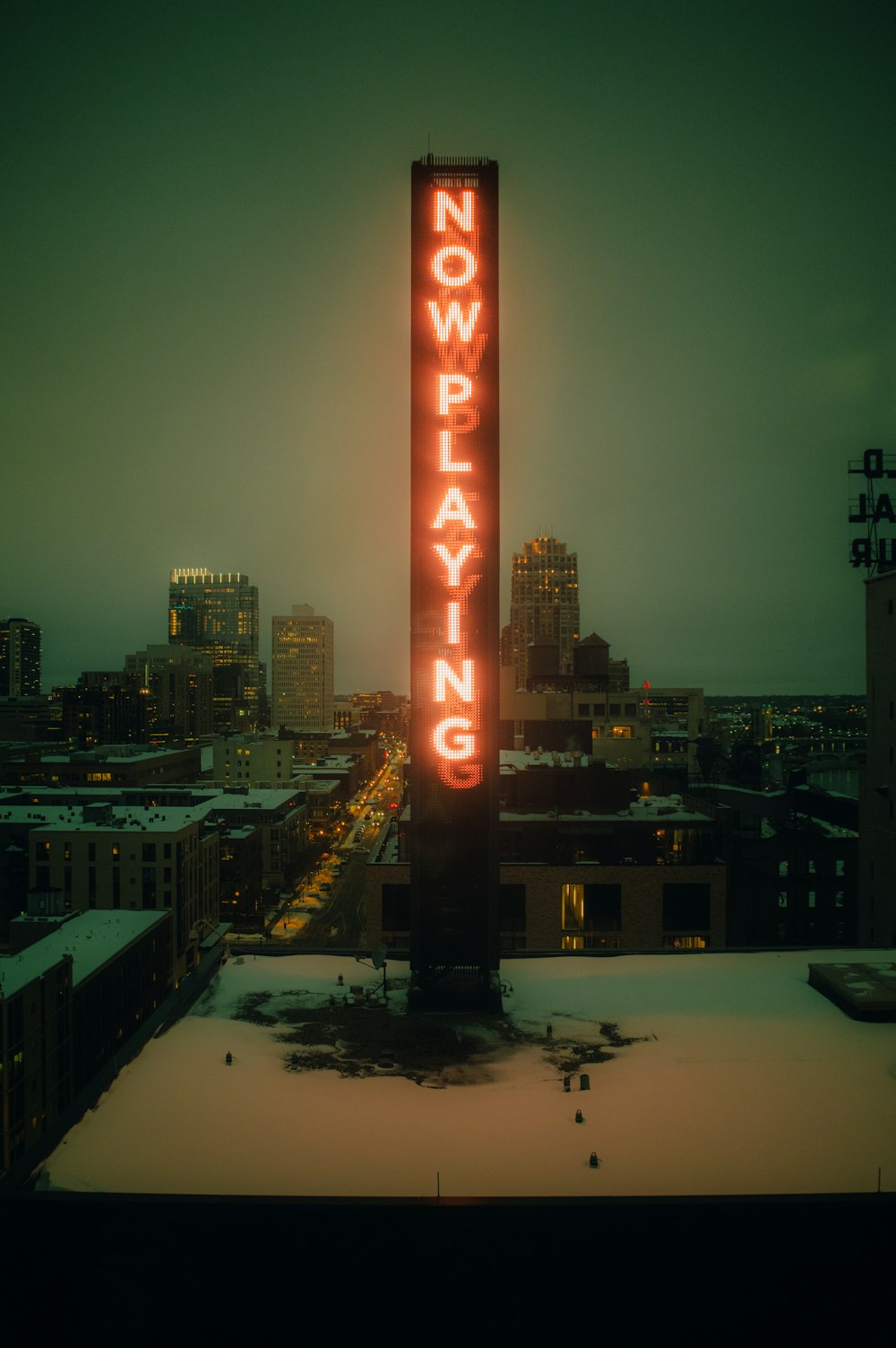 a neon sign that says no playing in the snow